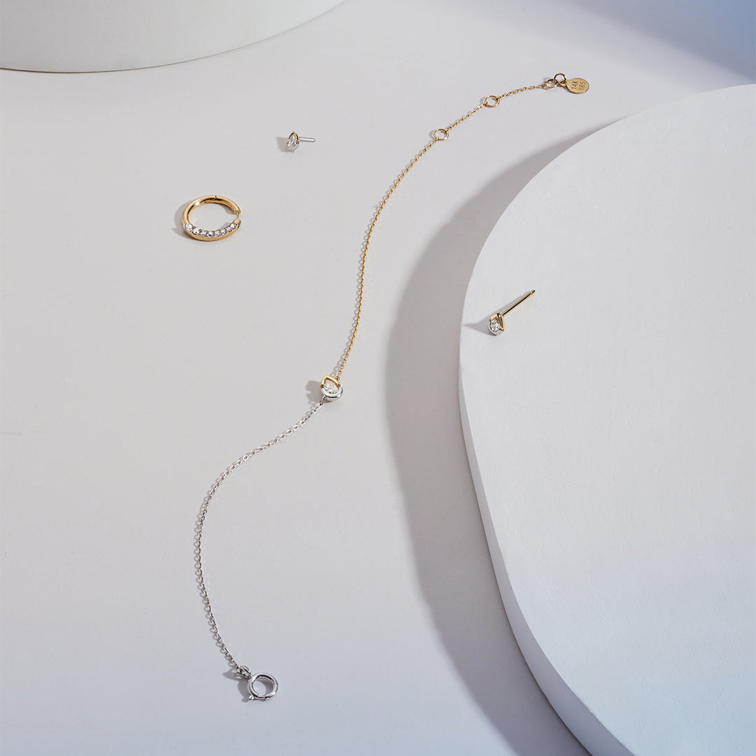 SANILIA | Two-Tone Bezel Pear LGD Stud Earring