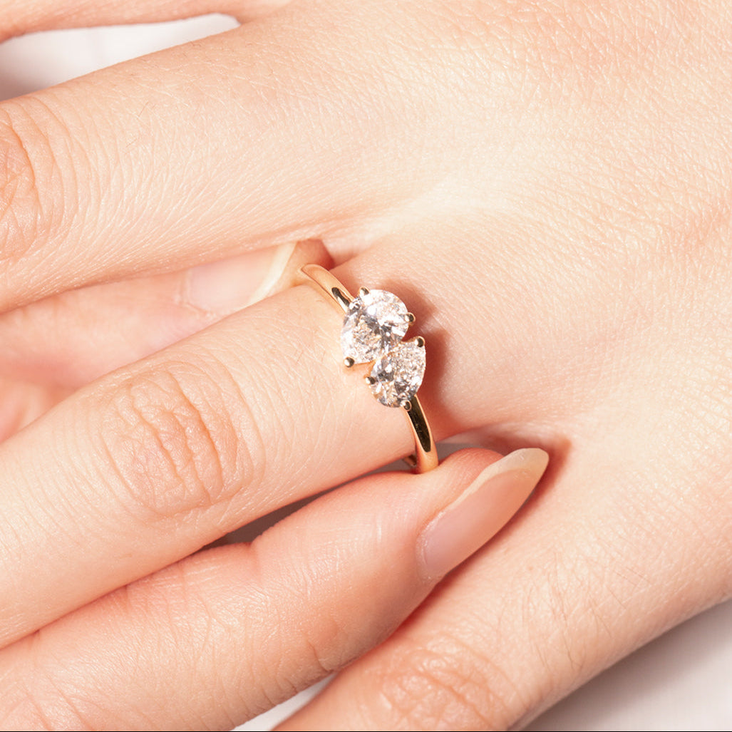 Elegant 14K gold ring featuring dual pear-shaped lab-grown diamonds for timeless connection