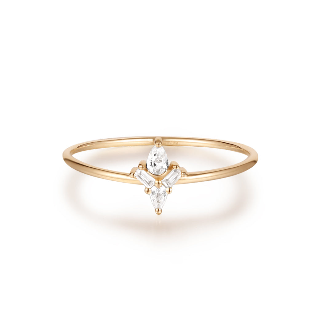 White sapphire ring with baguette and pear-cut stones in a cluster setting, designed for stacking or solo wear